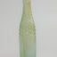 Clear glass with green tinge, whirley twisted pattern on shoulders, five plain panels on body