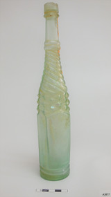 Clear glass with green tinge, whirley twisted pattern on shoulders, five plain panels on body