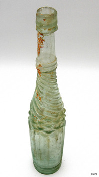 Inside of bottle has orange-brown sediment along one side. Lip looks roughty applied.