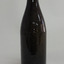 Dark brown glass bottle, tall and slim, , with a ring band on eck.