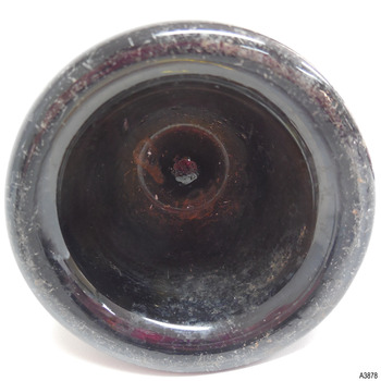 Base is pushed up and has a pontil mark in the centre. 