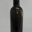 Round bottle has shiny dark glass, is tall and slim and tapers towards base.