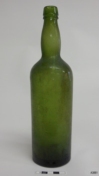 Green bottle, tall and narrow, bulbous neck.