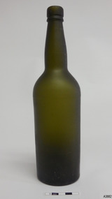 Tall narrow bottle with matt dark green glass