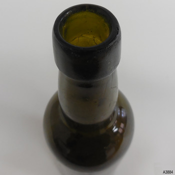 Applied lip with wide collar, bulbous neck. Bottle has concentric horizontal rings in glass