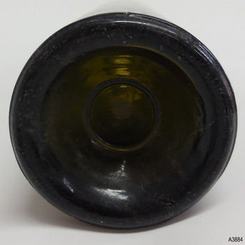 Base has thick heel and is pushed up, showing a wide innder circle mark.
