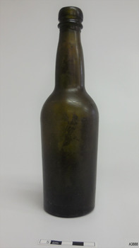 Bottle, olive green,  has double collar, slightly bulbous neck and body tapers to base