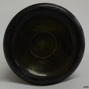 Base is pushed up and has a large ring around the centre within the glass