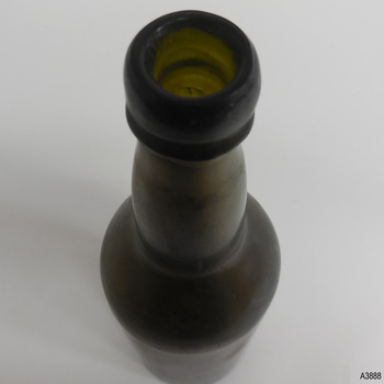 Applied double lip has wide upper and ring lower, neck is bulbous, shoulders rounded, body tapering inwards
