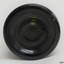 Base has imperfections in glass, is pushed up into bottle and has several rings formed within the glass.