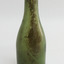 Green bottle has blob top and smooth lines, body tapers inwards to base.