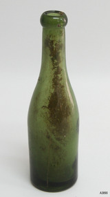 Green bottle has blob top and smooth lines, body tapers inwards to base.