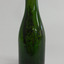 Green bottle is tall and slim with smooth lines and has a blob lip