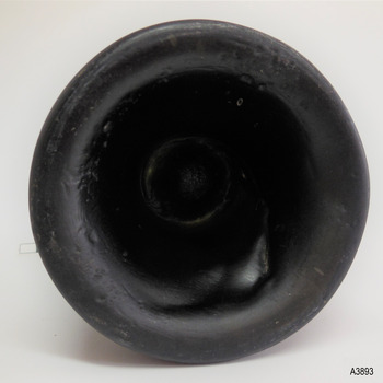 Heel is thick and uneven with a blob of glass overlapping the pushed-up centre. It has an inward pontil mark.