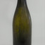 Olive green bottle has smooth lines, cork top with straight band collar