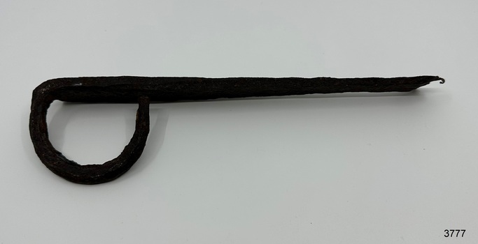 Iron latch has an almost circular loop handle