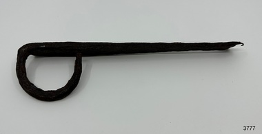 Iron latch has an almost circular loop handle