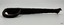 Latch's flat surface is slightly curved along its length. Thickness is very uneven.