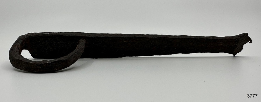 Latch's flat surface is slightly curved along its length. Thickness is very uneven.