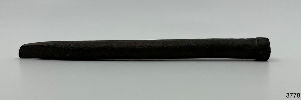 Iron bold has squared sides, a chisel end and a round, beaten head