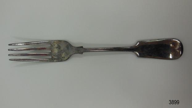 Silver plated dinner fork with small shoulder and rounded handle-end