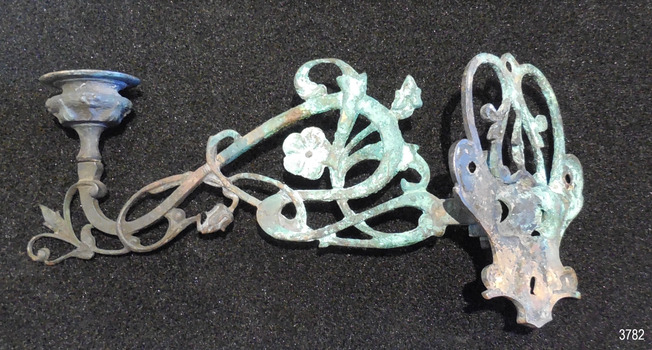 Reverse side of bracket with fancy ironwork
