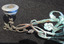 Candle holder at end of fancy work bracket with floral decoration