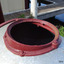Inlet opening has a flange that is bolted onto the top of the tank