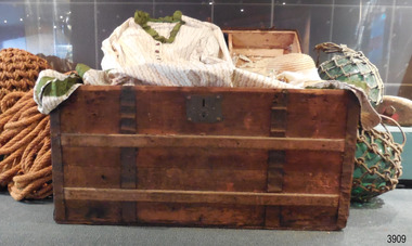 Wooden trunk, with metal reinforcing bands and strong metal lok
