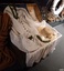 Garments on display in open trunk. Partitioned lid has pasted illustration