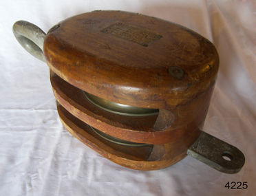 wooden two-sheave block with metal sheaves and strap