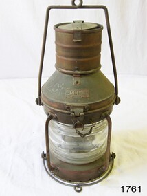 Lamp with metal frame and handle and glass lamp cover
