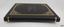 Spine neatly bound, top and bottom boarder in gold lines matching front cover
