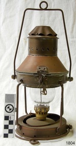 Brass and glass lamp with latch on top cover