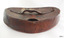 Lid is curved. Handle's underside is moulded to the shape of a hand. Tab opening has also been moulded.