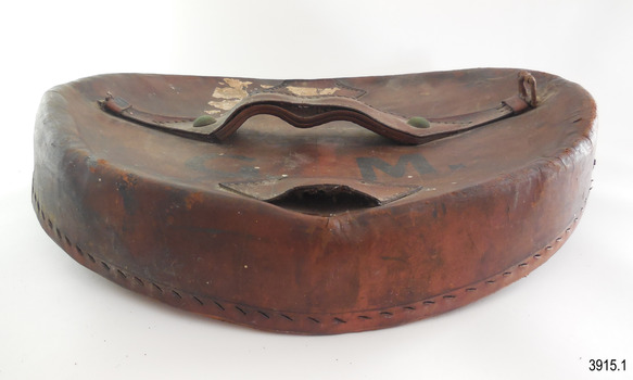 Lid is curved. Handle's underside is moulded to the shape of a hand. Tab opening has also been moulded.