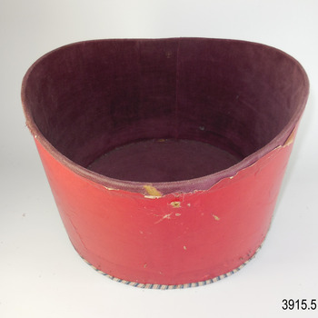 Inner box has red paper cover on the outside and brown velvet lining and blue and white striped paper covers the base.