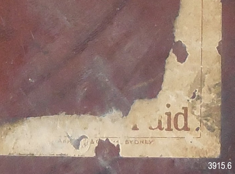 Label remnants, "- aid" and 'SYDNEY" can be read