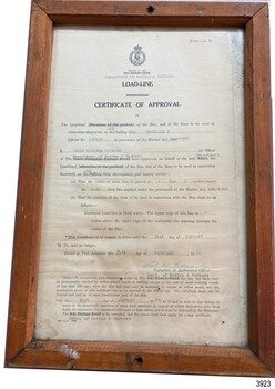 Certificate in frame behind glass. Printed certificate, overwritten by typewriter, hand written details and signature.