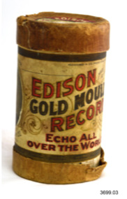 Upright gramophone record cylinder with colour printed label