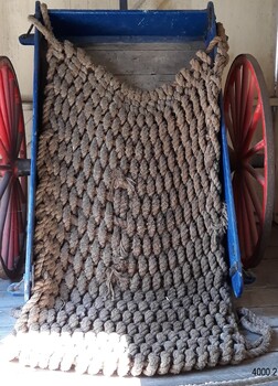 Cover has self-made loops that fit over each corner of the cart's tray