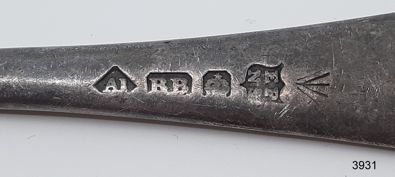 Five stamped marks, four within various shapes.