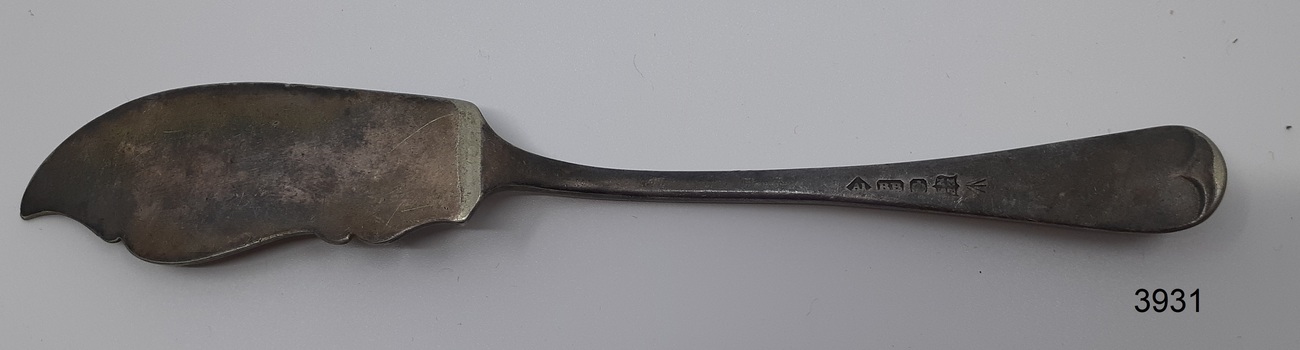 Blade's surface is plain. Handle has several stamped marks