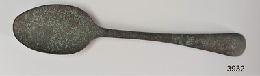 Alloy teaspoon with surface Verdigris. Silver electroplating no longer exists.
