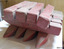 Pegs have square shank profile, bevelled edges, hole near centre of length. 
