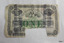 One-pound note printed in black with green. Cancellation stamp. Rectangular notch on bottom edge.