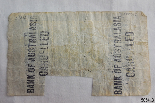 There is no printing on the reverse. Cancellation stamps and handwritten text has been added.
