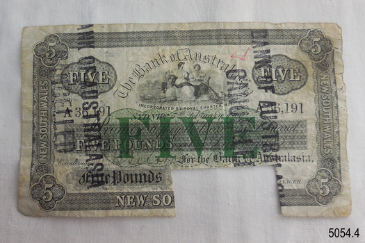 Five-pound note printed in black with green. Cancellation stamp. Rectangular notch on bottom edge.
