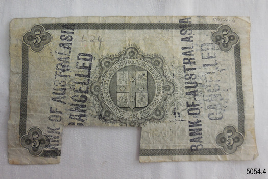 Five-pound banknote has printing on reverse. Cancellation stamps and handwritten text are added.