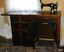 Cabinet is fitted with shelves, machine is operated by treadle